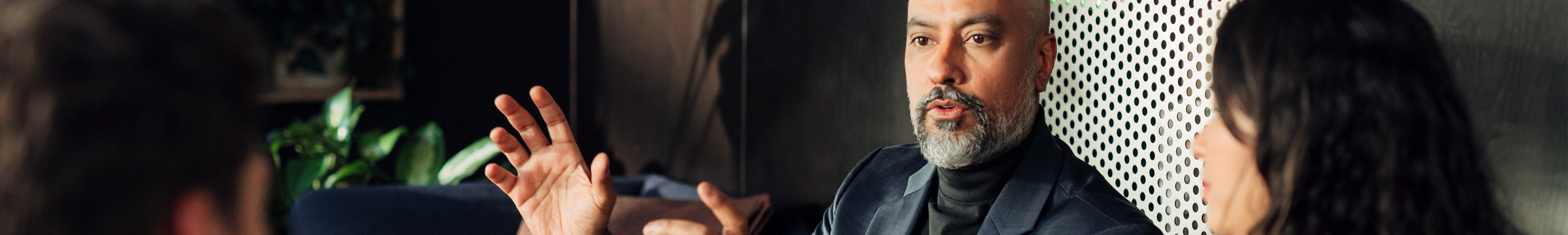 Man in front of monitors